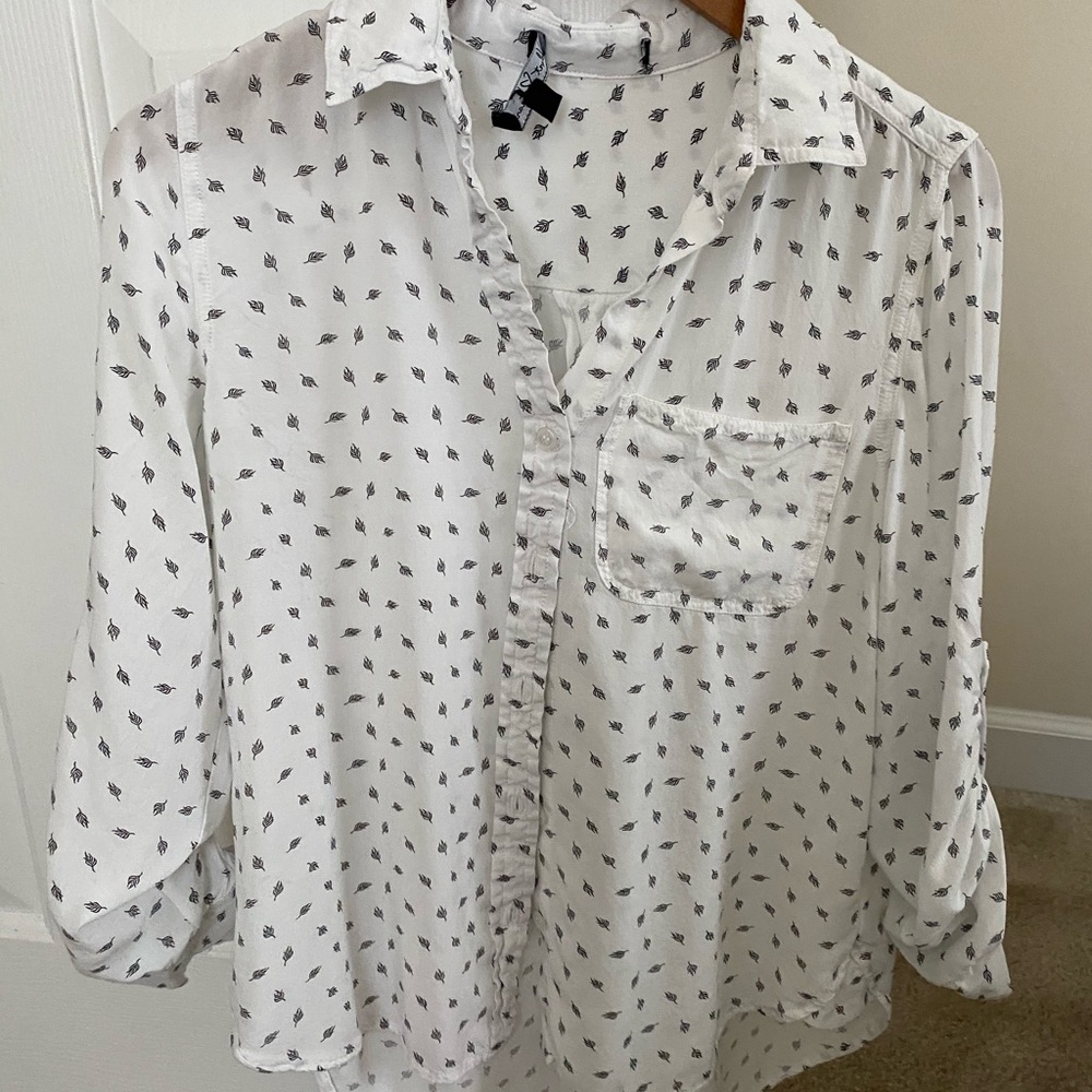 White and black blouse.
